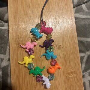 Colorful Dinosaur phone charm wristlet